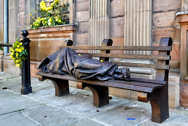 Photograph of sculpture depicting 'homeless jesus'
